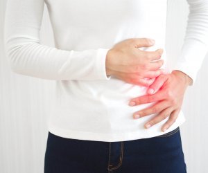 hepatosplenomegaly or hsm and ruptured spleen in woman ,She touching on chest and symptoms of pain and suffering in the upper right portion of abdomen and above stomach and use for health care concept